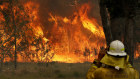 A firefighter watches the Old Bar fire . 