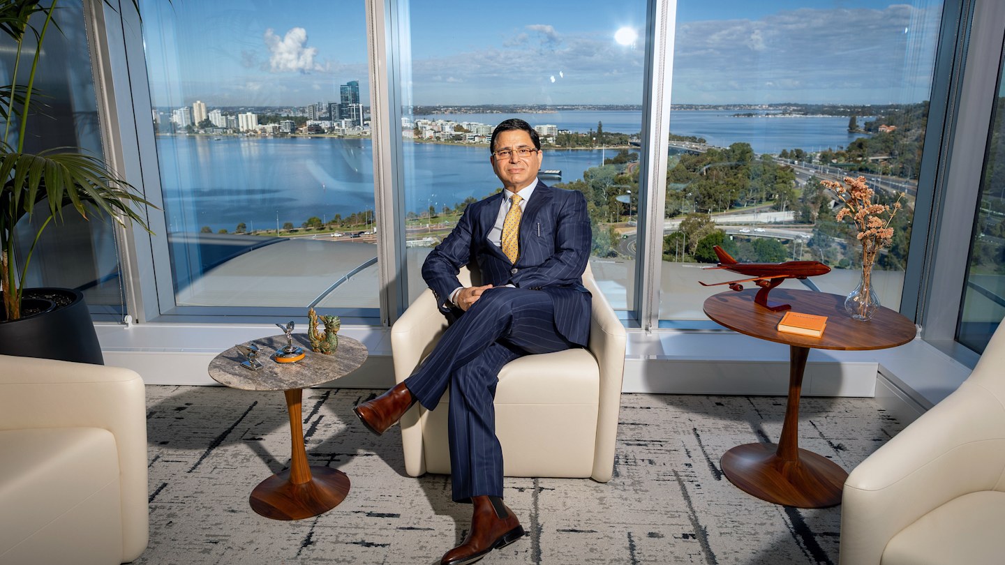 A portrait of Perdaman Group founder Vikas Rambal and Rich List 2025 member in his Perth office overlooking the Swan River.