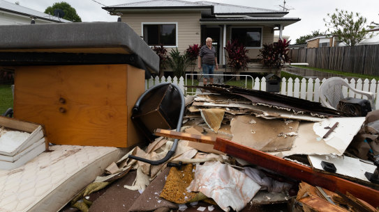 Robert Graham surveys his waterlogged possessions.