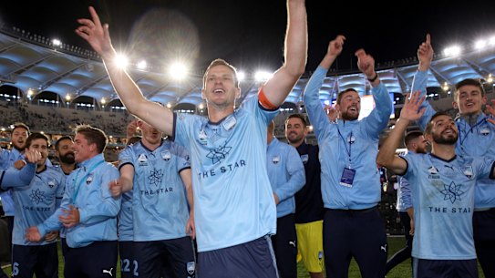 Sydney FC celebrate winning the A-League title on Sunday night. 