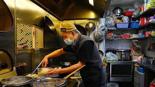 Staff at Nanjing Dumpling restaurant prepare food in Sydney’s Chinatown on Friday.