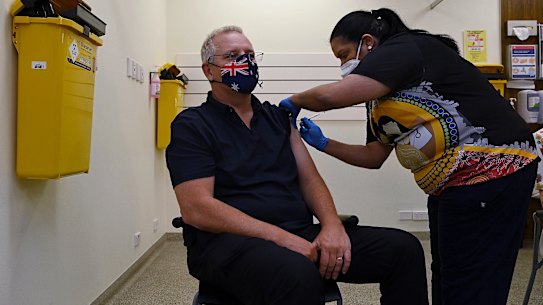 Prime Minister Scott Morrison receiving his COVID-19 booster vaccination on Friday. he said states should step back from controlling residents as vaccination rates continue to rise.