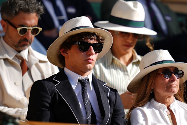 F1 Mercedes driver Andrea Kimi Antonelli of Italy sits in the Royal Box on day eight at the Wimbledon Tennis Championships in London, Monday, July 6, 2026.(AP Photo/Kirsty Wigglesworth)