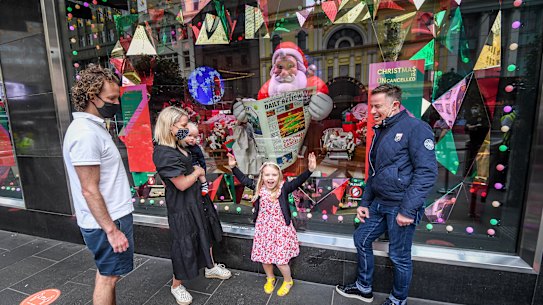 Stage ONE creative director John Kerr (right) with Sam, Anthea, Hamish and Camilla McCombe outside the Bourke Street windows.
