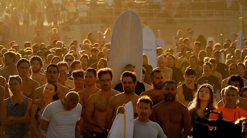 In pictures: Emotional scenes as surfers paddle out at Bondi