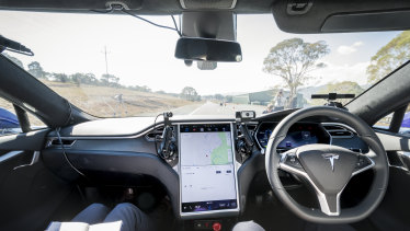 The view from behind the wheel of a Tesla vehicle fitted with Seeing Machines' driver monitoring technology.