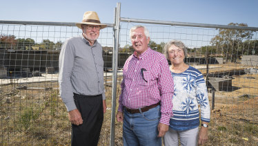 Giralang Residents Action Group members Bill Burmester and Ross and Olga Calvert, at the site of the old Giralang shops after redevelopment plans were submitted last month.