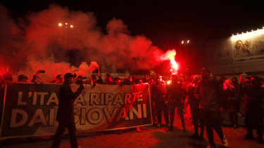 Tighter restrictions in Italy have triggered protests in Rome.