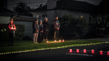Macleod residents rugged up in the dark to pay their respects.