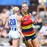 Ash Woodland celebrates one of her goals for Adelaide.