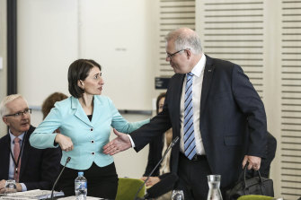 Prime Minister Scott Morrison greets Premier Gladys Berejiklian at a COAG meeting in March 2020.