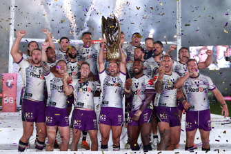 Smith and the Storm celebrate their grand final win over Penrith in October.