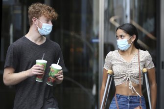 Reuben Glasser and Izzy Lingam at Bondi Junction say they are happy everyone is being forced to wear masks.