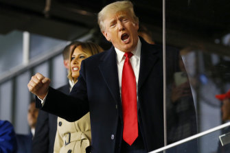 Former president of the United States Donald Trump waves prior to Game Four of the World Series between the Houston Astros and the Atlanta Braves Truist Park on October 30, 2021 in Atlanta, Georgia. 