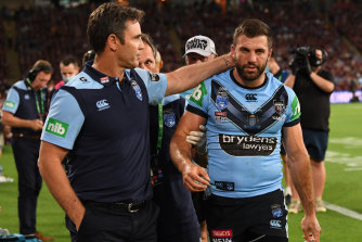 Brad Fittler consoles James Tedesco as he comes from the field with concussion.