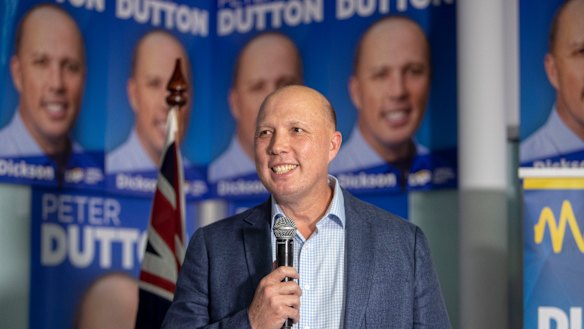 Home Affairs Minister Peter Dutton celebrates his return to the seat of Dickson while in Strathpine on election night.