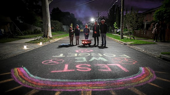 Mark Di Pasquale's daughters wrote 'lest we forget' in chalk on the street.