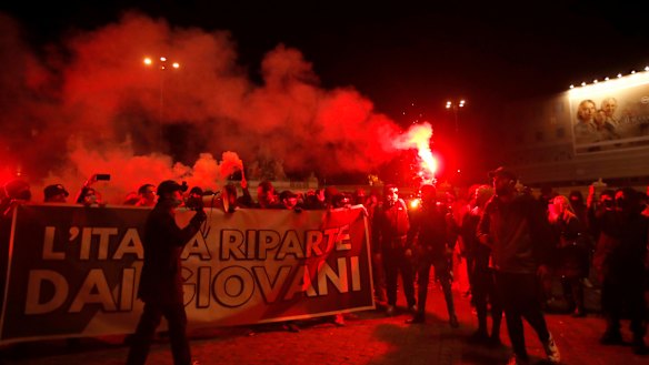 Tighter restrictions in Italy have triggered protests in Rome.