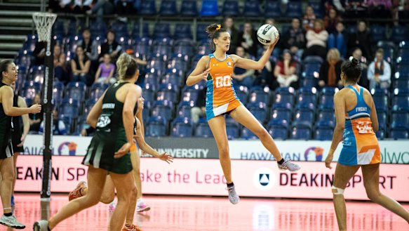 Canberra Giants defender Kara Styles flies high in the grand final on Sunday. 