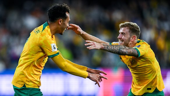 Australia’s Nishan Velupillay celebrates with Riley McGree after scoring in the 3-1 win over China on Thursday.