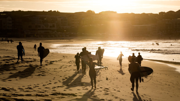 Surfers have returned to Bondi Beach, with restrictions slowly being eased across the state of NSW.
