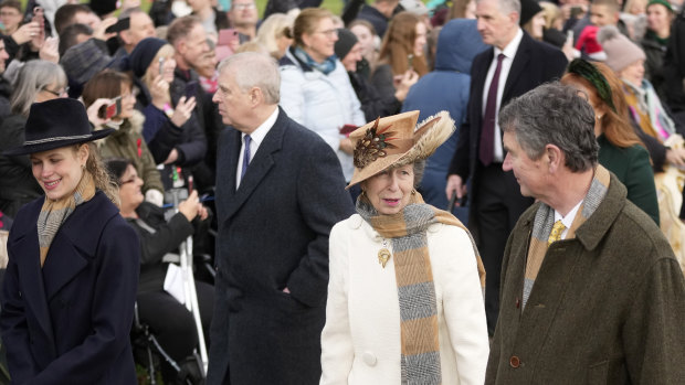 Princess Anne, centre, with her husband Timothy Laurence, right, and Prince Andrew (left) arrive at Christmas morning service.
