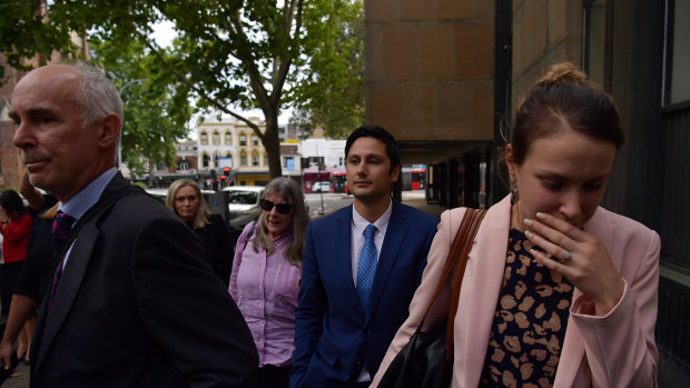 Hannah Quinn and Blake Davis, flanked by family, leave the Supreme Court on bail.