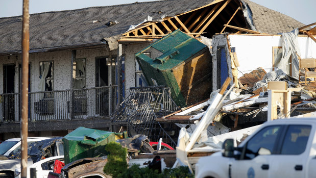 Part of a roof is exposed at the American Budget Value Inn after a tornado moved through the area.