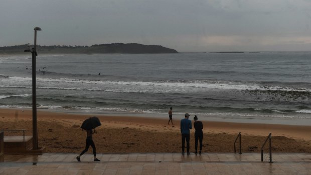 A wet and quiet morning on Dee Why beach as rain falls across the Sydney region. 