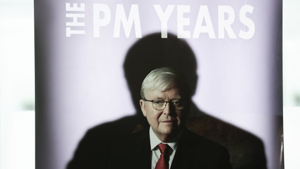 A shadow of former prime minister Kevin Rudd is cast on a promotional banner during the launch of his book at Parliament House on Tuesday.