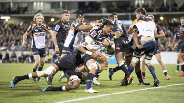 Pete Samu breaks through for one of his two tries in the Brumbies' thumping victory over the Sharks on Saturday night.