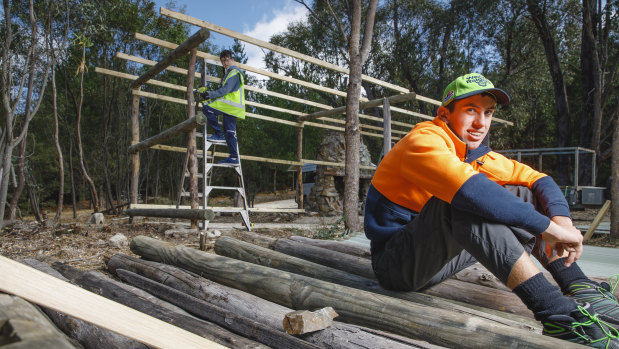 Volunteers Jacques Slater-McCabe, 12, and Cooper Temple-Clarke, 15, are taking time out of their school holidays to help restore Tidbinbilla Hut.