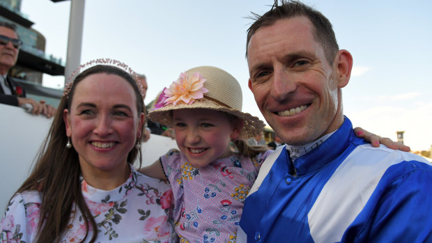 Happy family: Hugh Bowman with wife Christine and daughter Bambi after Winx's win on Saturday.