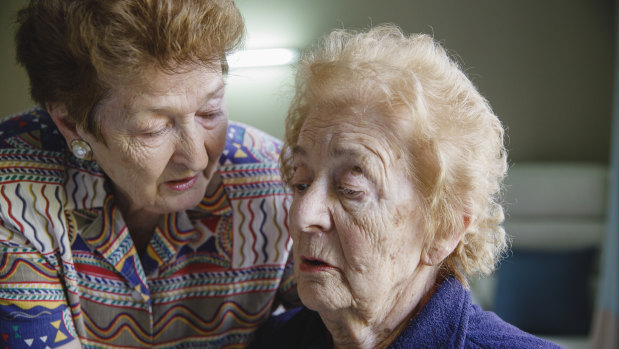 Irena Zuraszek, 91, takes care of her sister Wanda Solomon, 94, at Jindalee Aged Care Residence in Canberra.