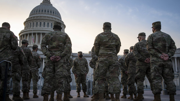 Members of the National Guard assemble outside of the US Capitol.