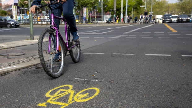 A cyclist uses a new bike lane in Berlin.