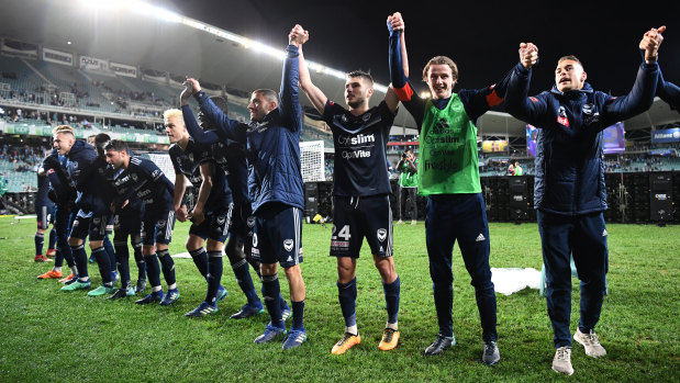 To the Victory goes the spoils: Muscat's team celebrate their passage into the A-League grand final.