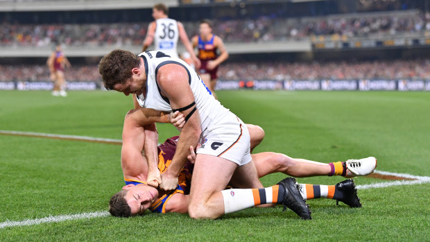 Wrestle-off: Heath Shaw grapples with Dayne Zorko in an incendiary semi-final.