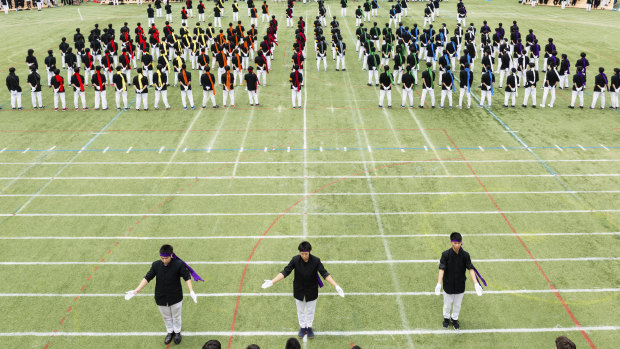 Colour-coded teams prepare for a botaoshi tournament at the Kaisei Gakuen school’s annual festival in Tokyo.