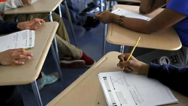 Students in Manhattan take a prep course for the SAT exam, a key factor in admission to US universities.