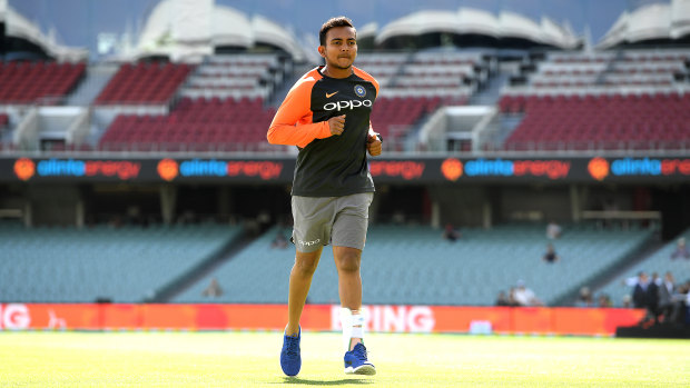 Injured cricketer Prithvi Shaw runs at the Adelaide Oval on Monday.
