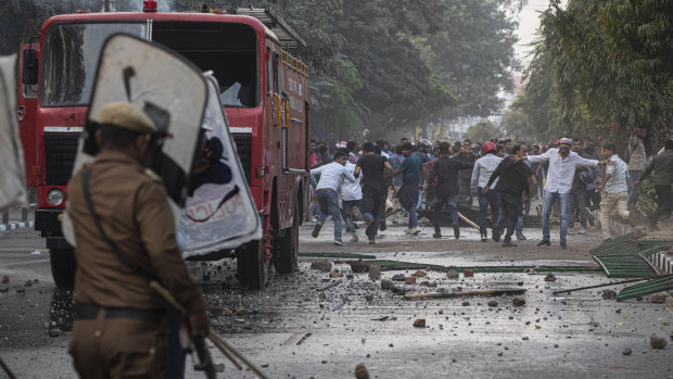 Protesters burnt tires and blocked highways and rail tracks for a second day as the upper house of Parliament began debating legislation that would grant citizenship to persecuted Hindus and other religious minorities but not Muslims.