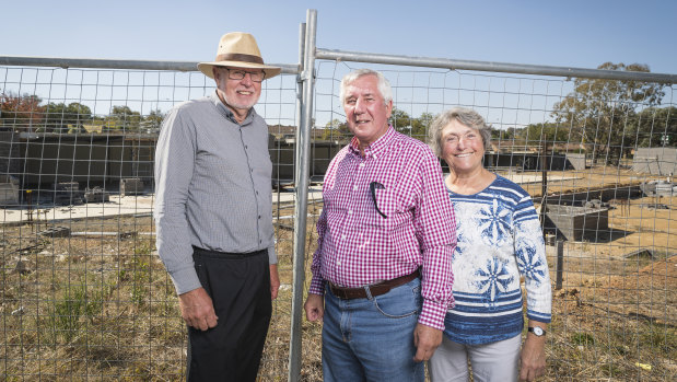 Giralang Residents Action Group members Bill Burmester and Ross and Olga Calvert, at the site of the old Giralang shops.