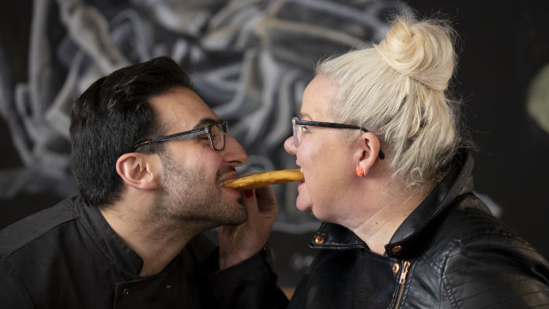 Anthony and I re-enact a scene from 'Lady and the Tramp' with a potato scallop.
