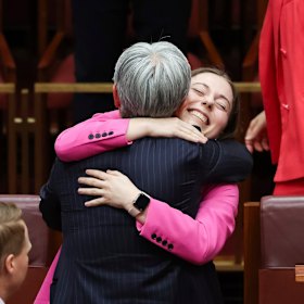 Walker is embraced by the leader of the government in the Senate and Minister for Foreign Affairs Penny Wong after delivering her first speech in the Senate.