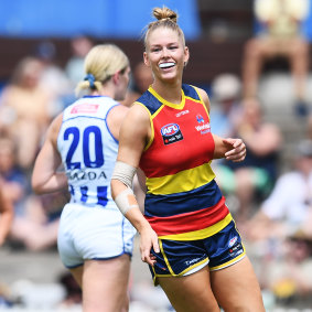 Ash Woodland celebrates one of her goals for Adelaide.