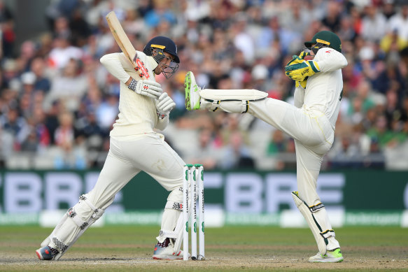 Australia's Tim Paine takes the ball during day five of the fourth Test. 