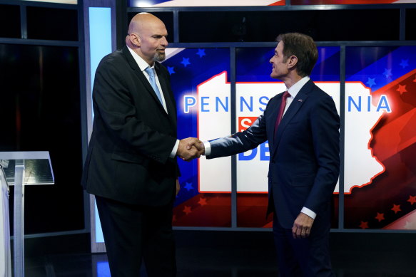 John Fetterman and Mehmet Oz shake hands prior to the debate.