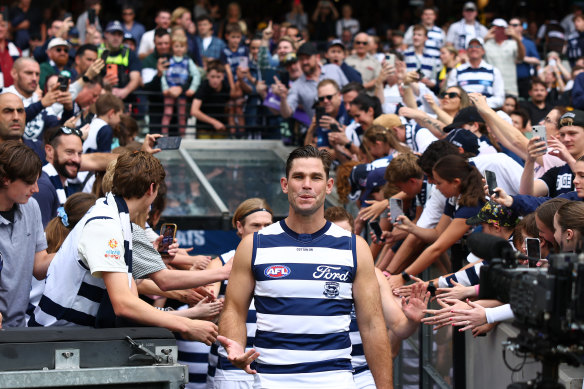 Tom Hawkins used a phone in the Geelong rooms on Monday but the Cats have only received a warning.