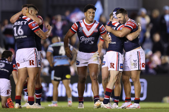 Yeah baby: Sydney Roosters players celebrate their sixth straight win